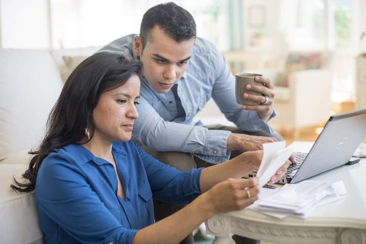 Couple reviews reasons not to refinance their home.