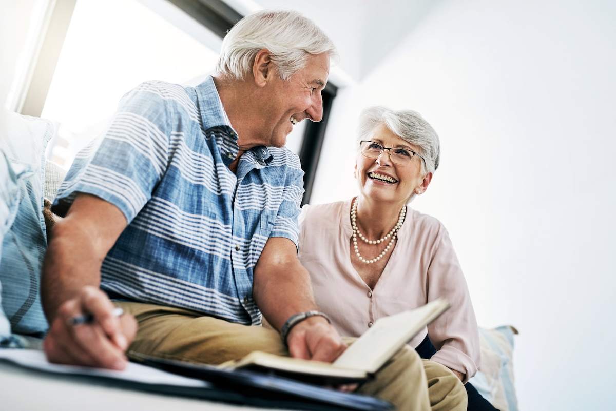 Senior couple reviews mortgage documents.