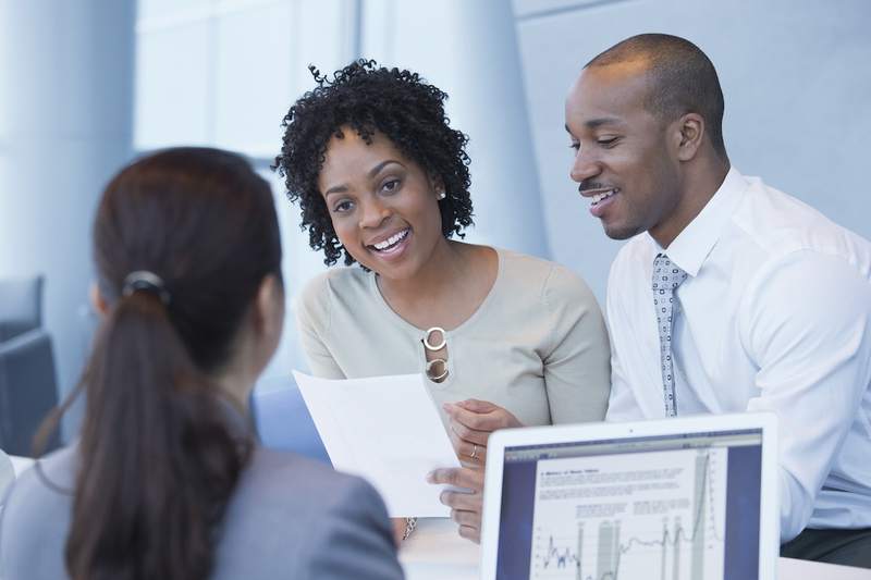 Couple meets with bank lender.