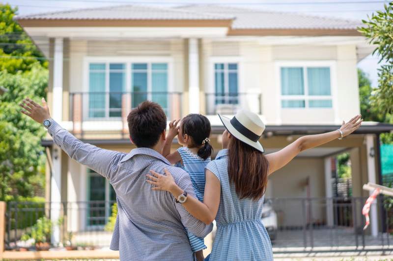 A family celebrates after completing their four-year plan to buy a home.