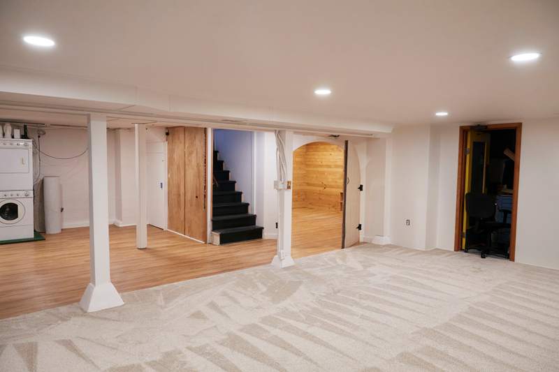 Stairs lead to a below-grade basement.