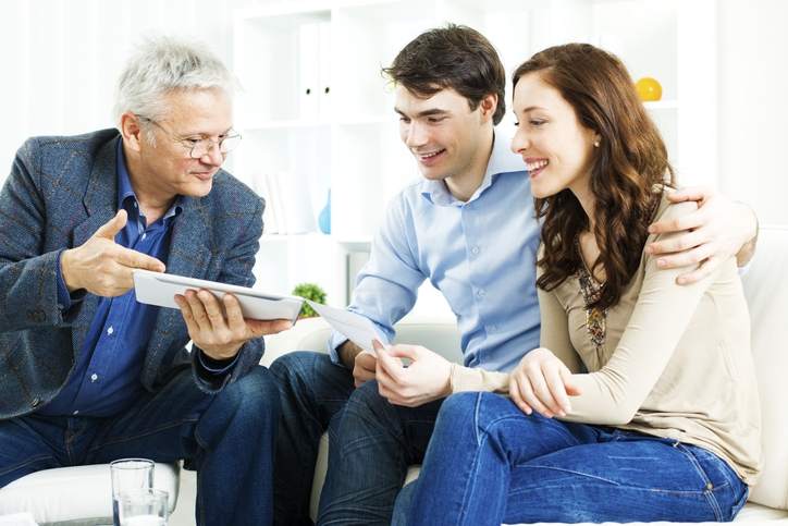 Financial advisor meets with couple.