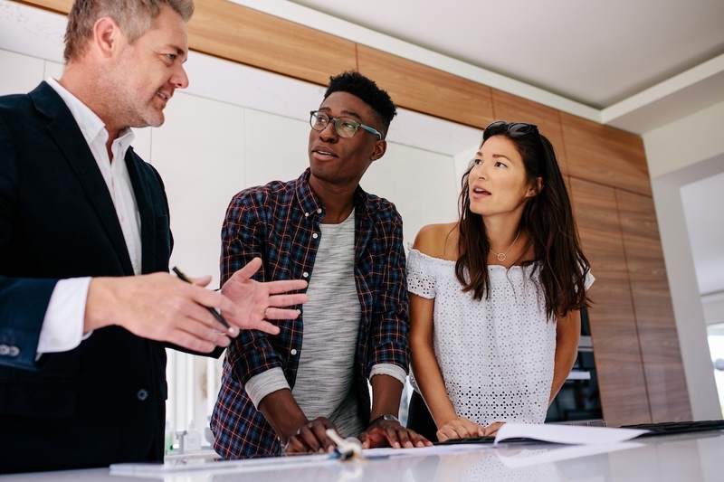 Couple meets with mortgage broker.