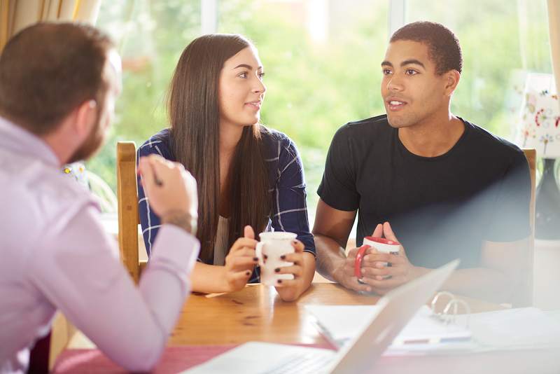 Agent discusses rent-to-own options with a couple looking to buy a home.