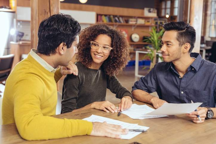 A couple meets with a financial advisor.