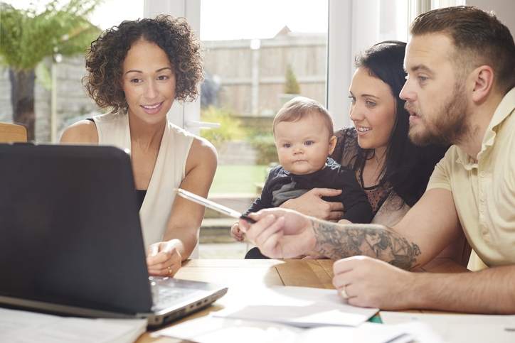 Family meets with a financial advisor about different types of mortgages.