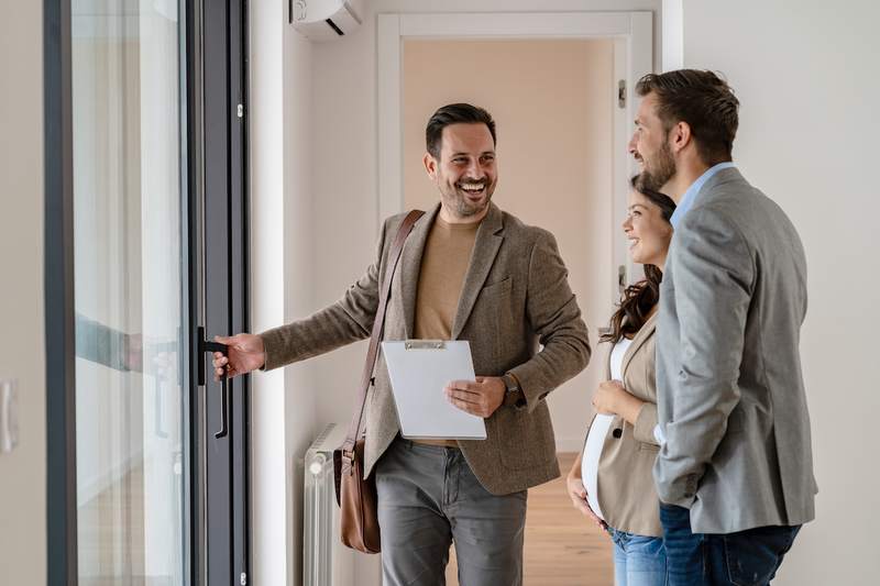 Agent shows a couple an affordable home for sale.