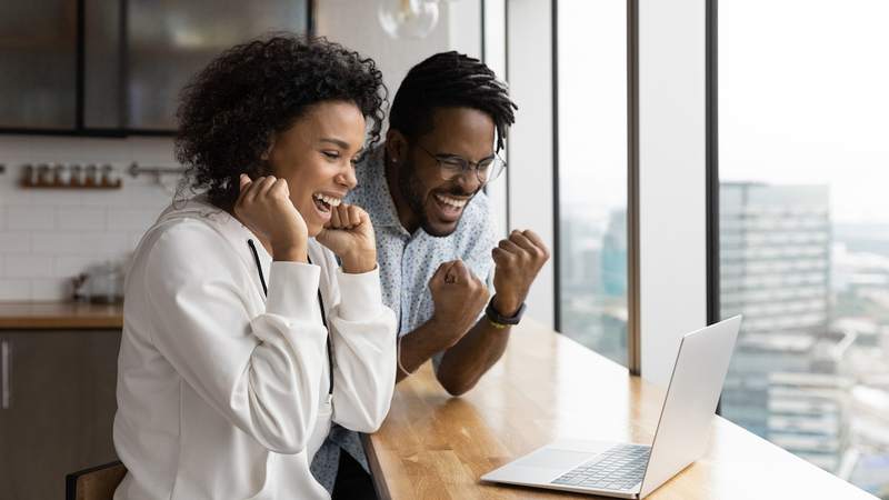 Couple celebrates being preapproved for a mortgage.