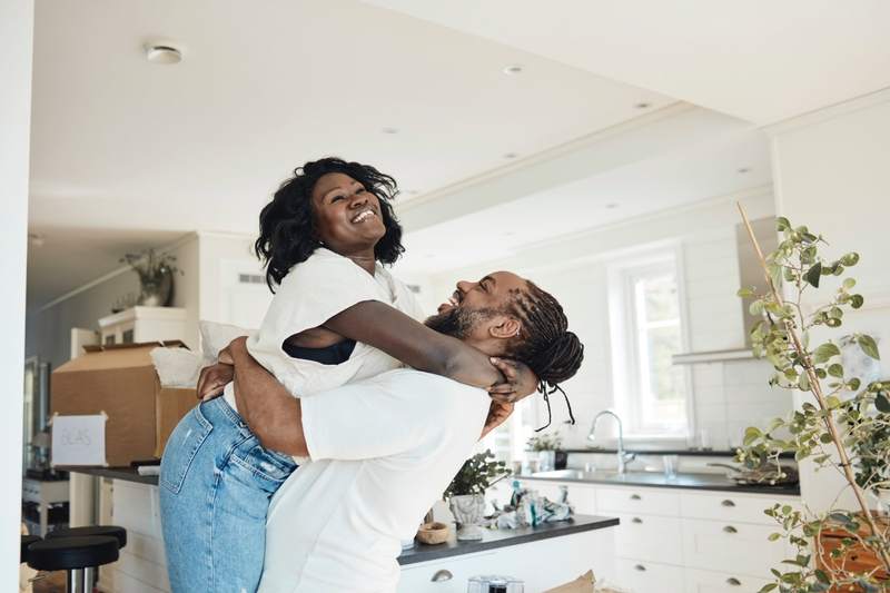 A couple celebrates after paying off their mortgage early.