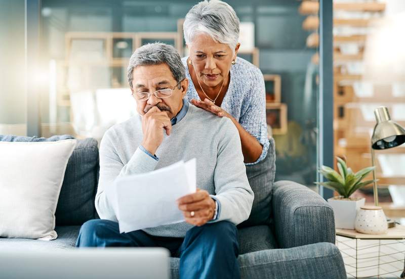 Older couple considers a reverse mortgage vs. a cash-out refinance.